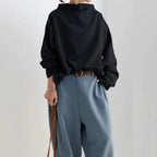 Black high-neck casual top with loose long sleeves and thick collar