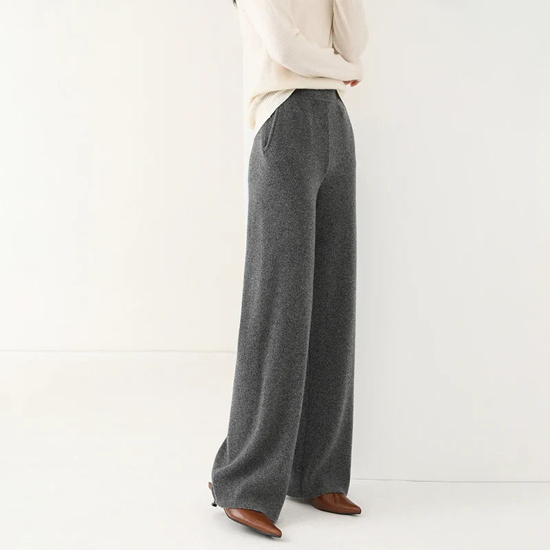 Dark gray wide-leg knit pants with pull-on waistband and relaxed straight leg fit.