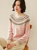Pink fair isle mock neck knit sweater, seated pose, patterned yoke detail