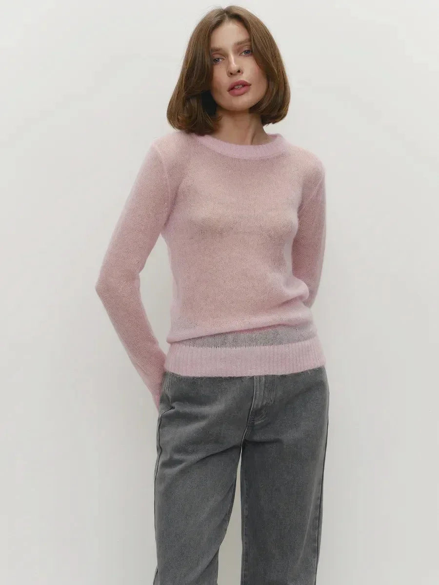 Light pink lightweight crewneck knit sweater with long sleeves and ribbed hem
