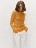 Mustard yellow crewneck knit sweater with long sleeves and ribbed hem