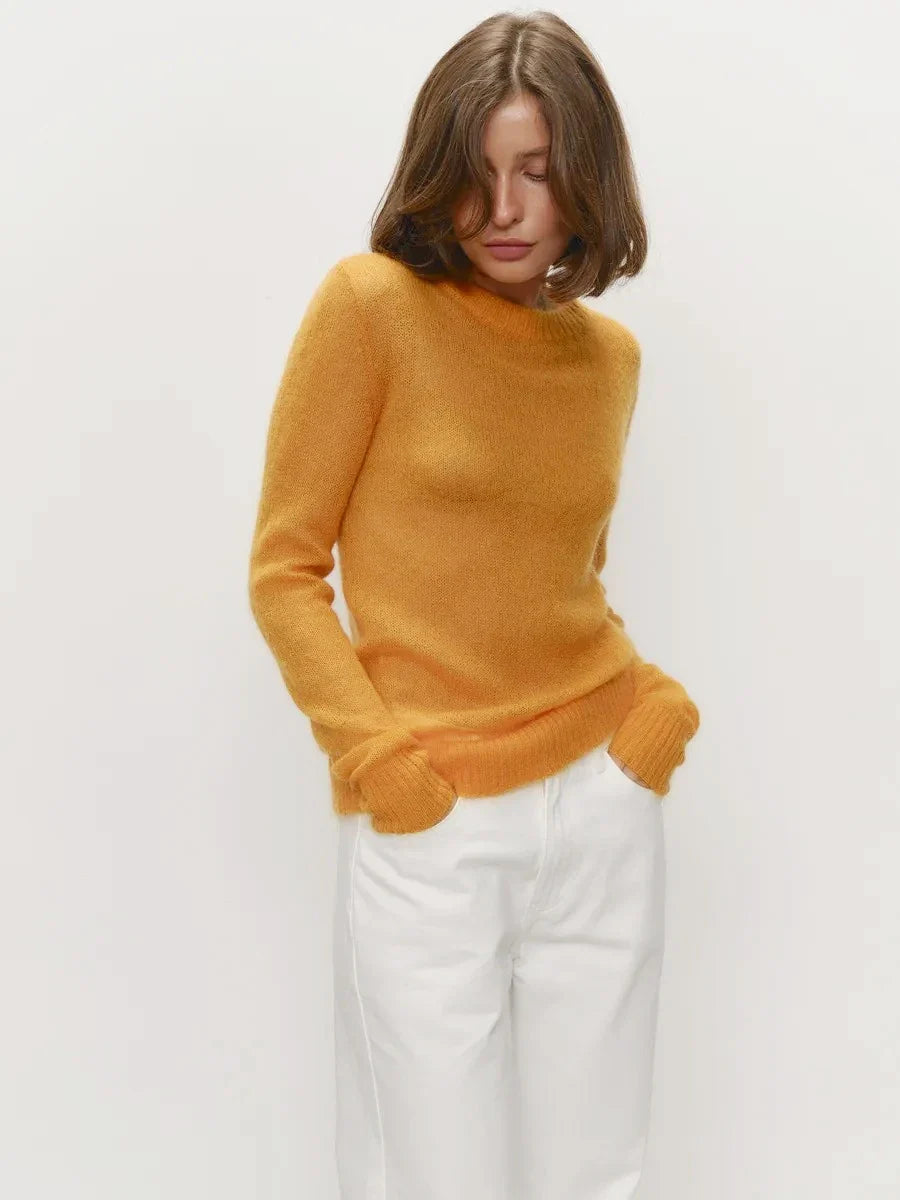 Mustard yellow crewneck knit sweater with long sleeves and ribbed hem