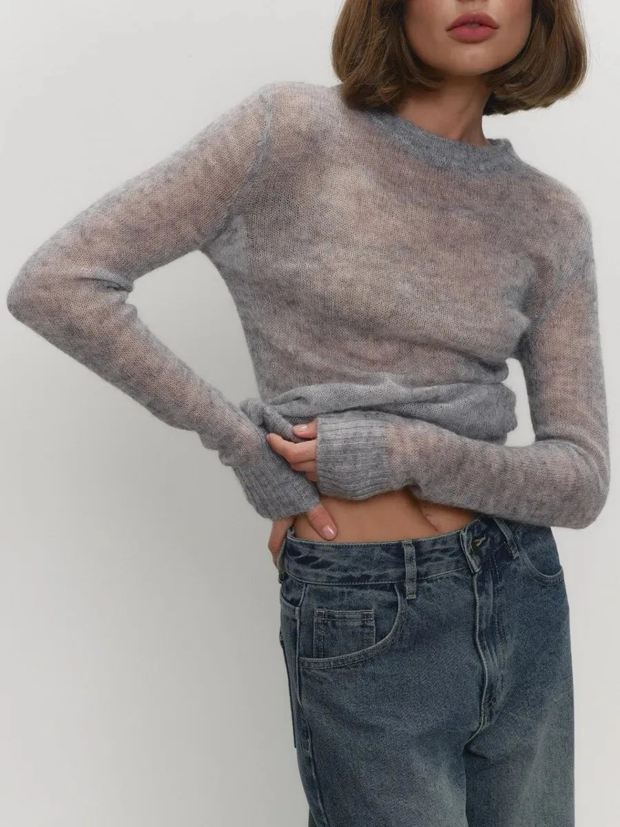 Grey crewneck knit sweater with long sleeves, ribbed cuffs, and fitted hem