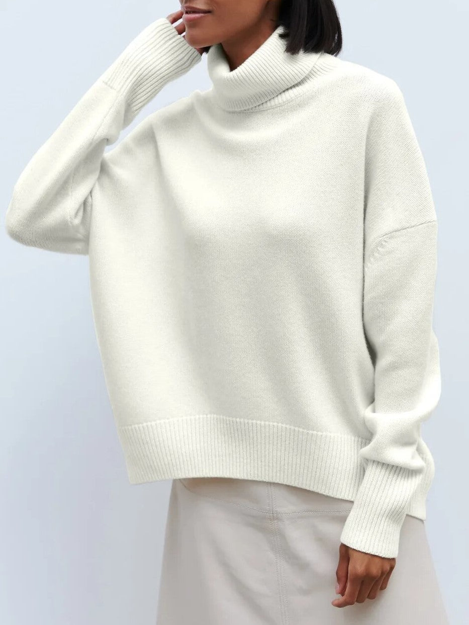 Cream oversized merino-wool blend turtleneck sweater, relaxed fit with ribbed hem