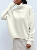 Cream oversized merino-wool blend turtleneck sweater, relaxed fit with ribbed hem