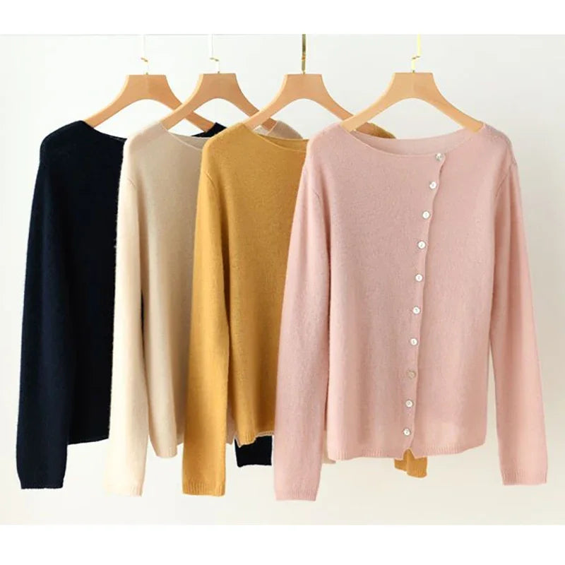 Multi-color asymmetrical button knit sweaters on hangers: beige, yellow, pink, navy