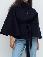 Navy wool-blend cape coat with stand collar and snap buttons; belted waist