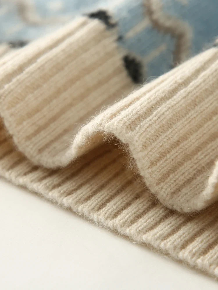 Cream and sky blue knit sleeve cuff with fair isle motif and ribbed trim