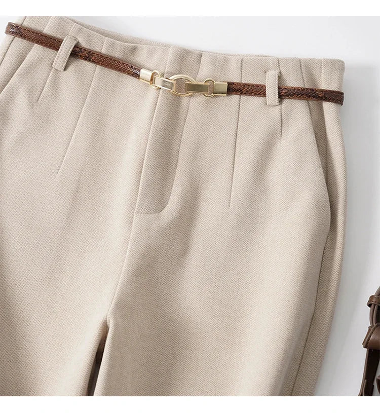 Light beige high-waisted wide-leg trousers with belt detail and pleated front
