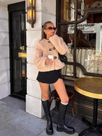 Beige teddy jacket with toggle buttons, long sleeves, plush fleece texture