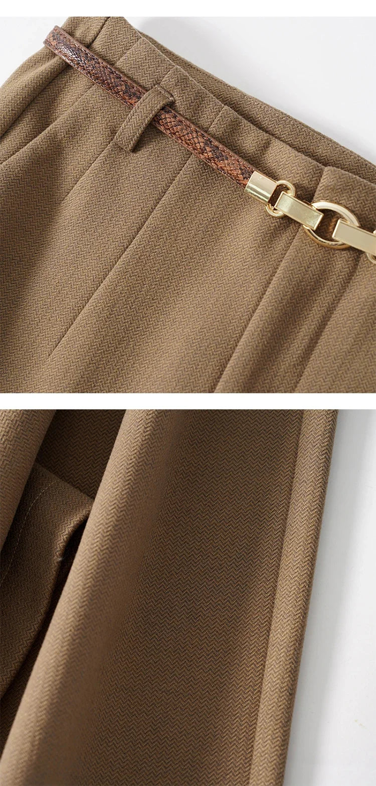 Tan trousers close-up of waistband and belt with gold-tone buckle hardware