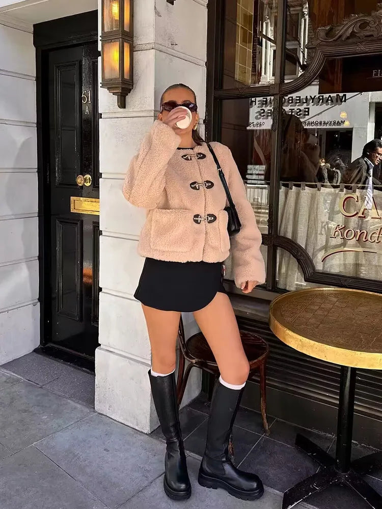 Beige sherpa-style button jacket with toggle hardware, long sleeves