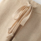 Light beige lounge pants with drawstring tie on the high elastic waistband.