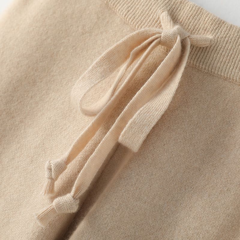 Light beige lounge pants with drawstring tie on the high elastic waistband.