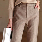 High-waisted herringbone wool-blend trousers in tan, zip fly, two front pockets and seam lines