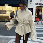 Ivory women’s wrap coat with tie waist and batwing-style sleeves