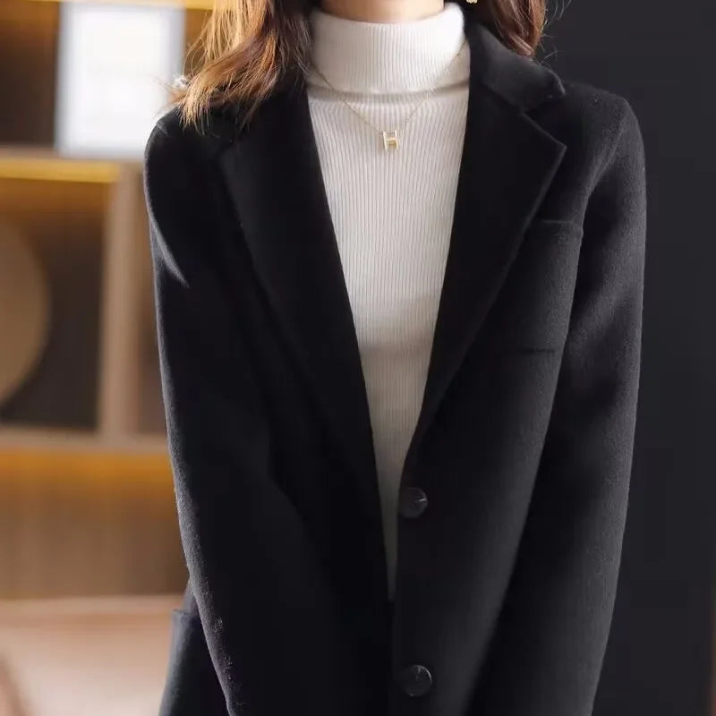Black wool blazer with notched lapels and two-button front