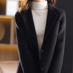 Black wool blazer with notched lapels and two-button front