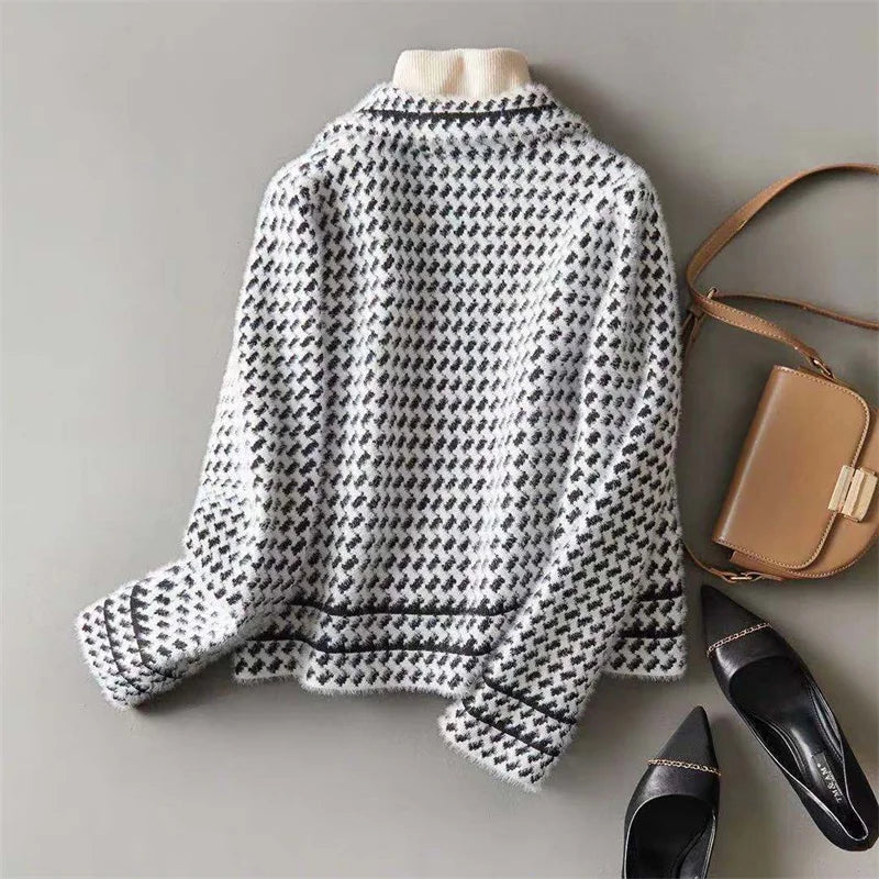 Houndstooth knit jacket with ribbed high collar and buttoned front, black and white