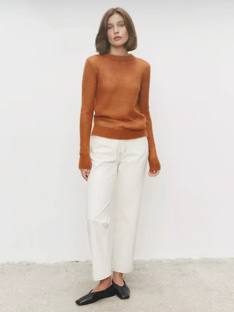Rust orange crewneck knit sweater with long sleeves and ribbed hem