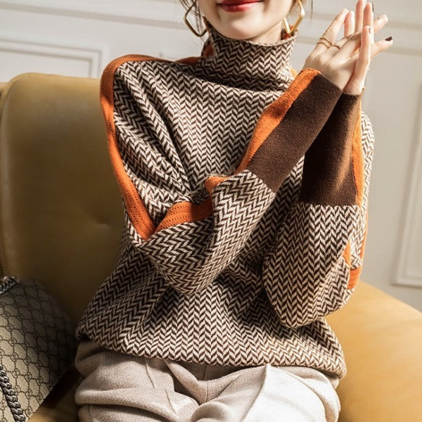 Herringbone turtleneck sweater with long sleeves and orange contrast trim