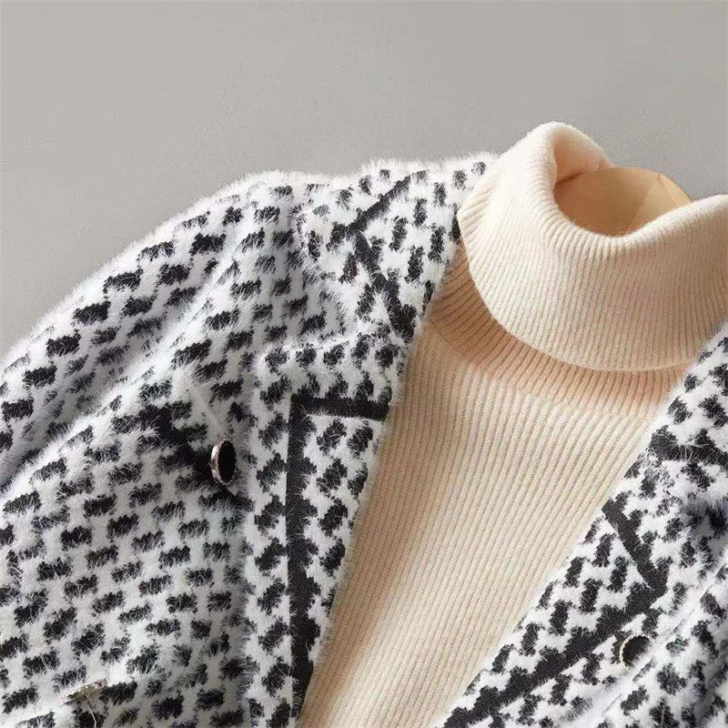 Houndstooth knit jacket with ribbed high collar and dark button placket, black and cream