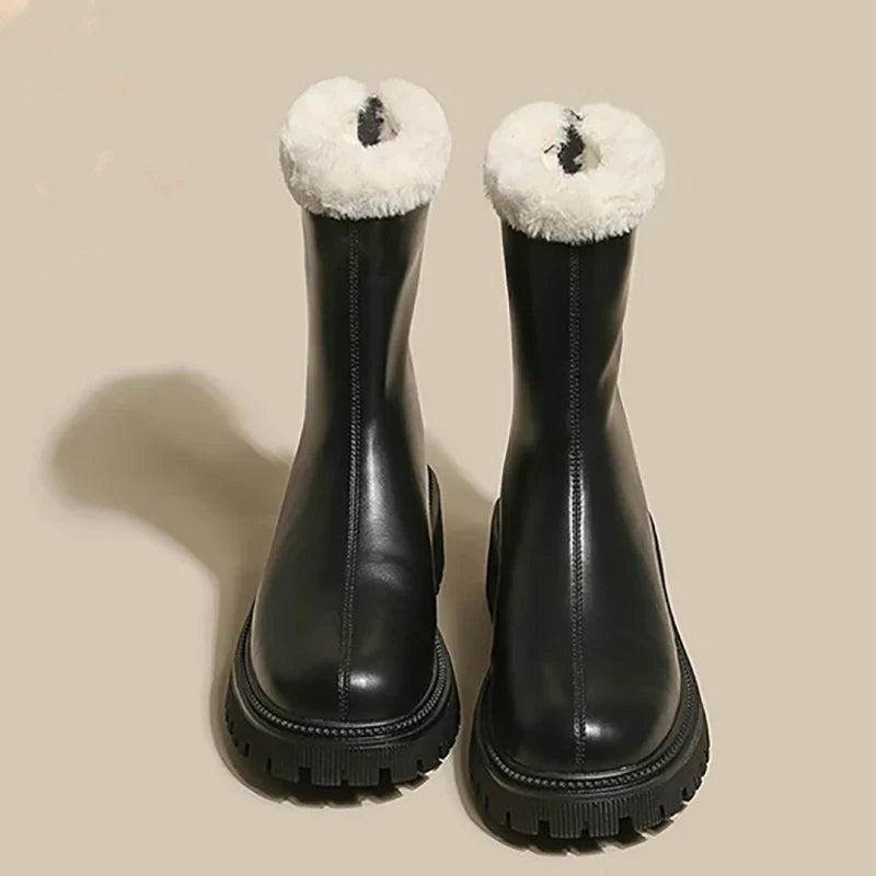 Black waterproof ankle boots with plush fleece cuffs and thick rubber lug sole