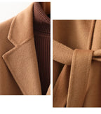 Camel wool coat detail: ribbed turtleneck cuff and soft structured lapel