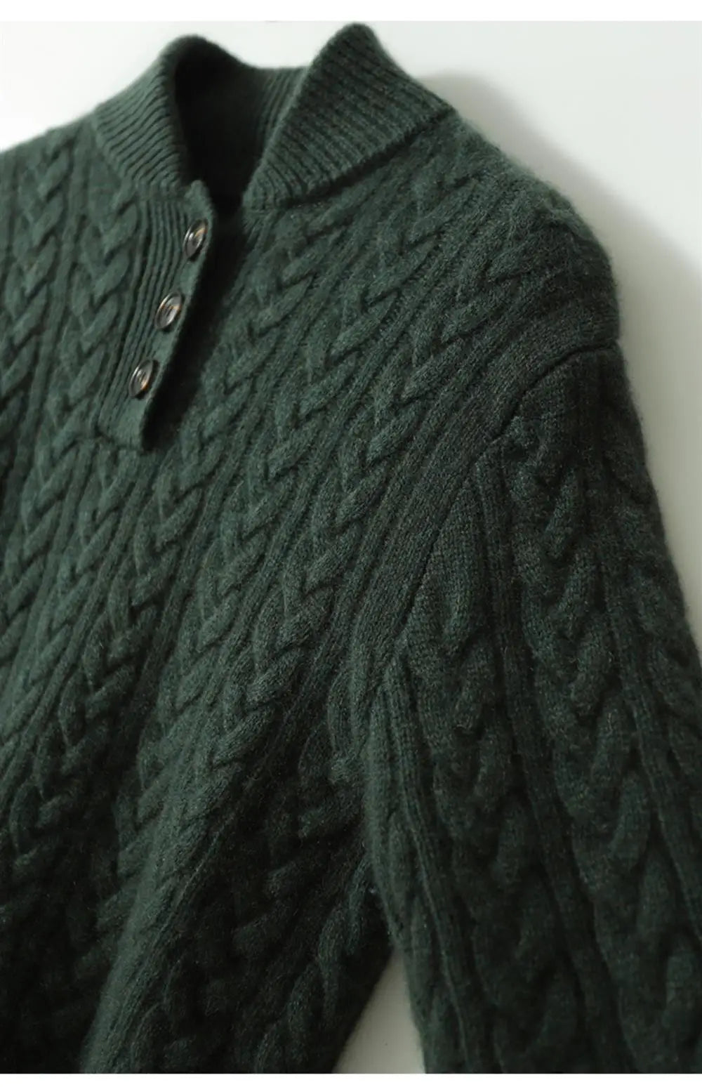 Dark green cable-knit cashmere sweater with three-button placket and ribbed cuffs