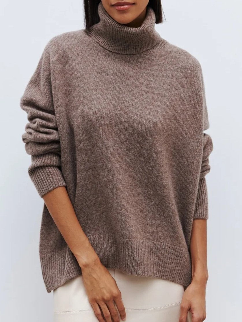 Taupe oversized merino-wool blend turtleneck sweater with ribbed collar and cuffs