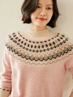 Pink fair isle knit sweater with mock neck and multi-color zigzag yoke pattern