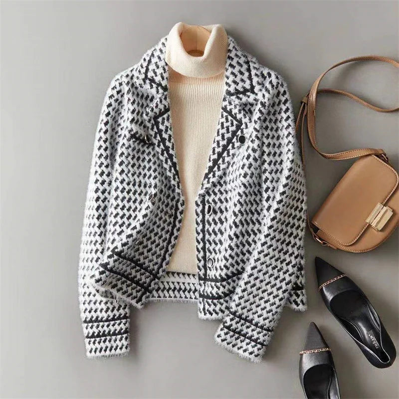 Houndstooth knit jacket with ribbed high collar, button front, and black trim