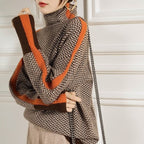 Herringbone turtleneck sweater with orange contrast edging and long sleeves