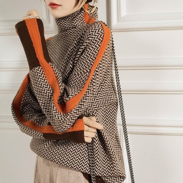 Herringbone turtleneck sweater with orange contrast edging and long sleeves
