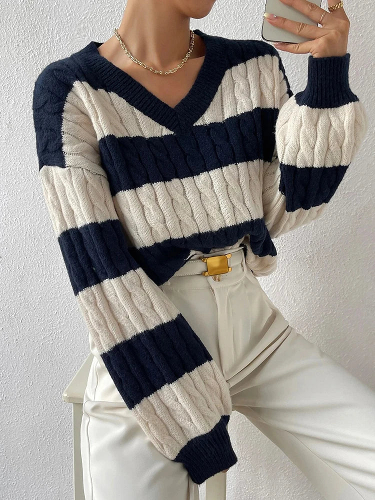 Striped V-neck cable-knit sweater with navy and cream horizontal stripes