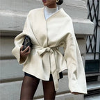 Ivory wrap coat with tie waist and long flared sleeves