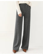 Gray merino wool wide-leg knit pants, relaxed fit with draped wide legs.
