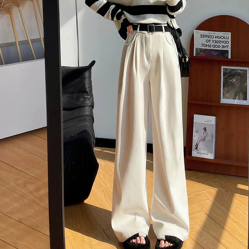 Cream corduroy wide-leg high-rise pants with belt and pleated front