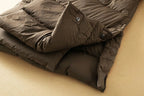Long down puffer parka with hood, dark brown front with buttons and hidden placket