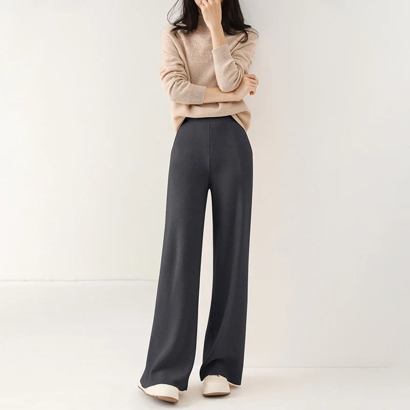 Midnight blue wide-leg knit pants with pull-on waistband and flowing, wide leg shape.