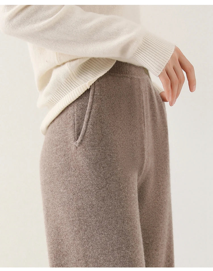 Taupe knit wide-leg pants, ribbed waistband and soft heathered merino texture.