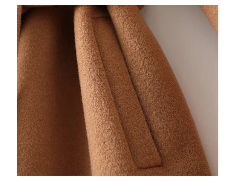 Camel wool coat fabric and skirt drape detail