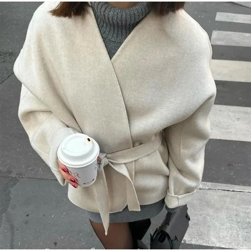 Ivory wrap coat with deep V front and tie waist belt