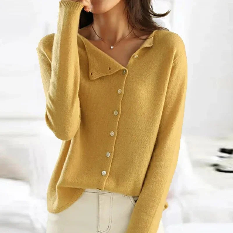 Yellow asymmetrical knit sweater with button placket and folded collar, long sleeves