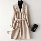 Wool belted midi coat in ivory with notched lapels and waist tie belt