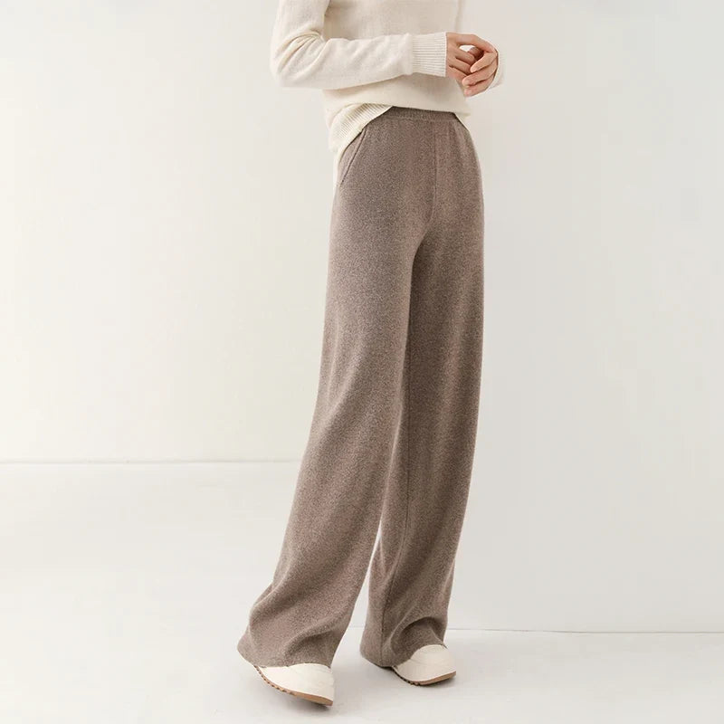 Taupe wide-leg knit pants with elastic pull-on waistband and loose, straight legs.
