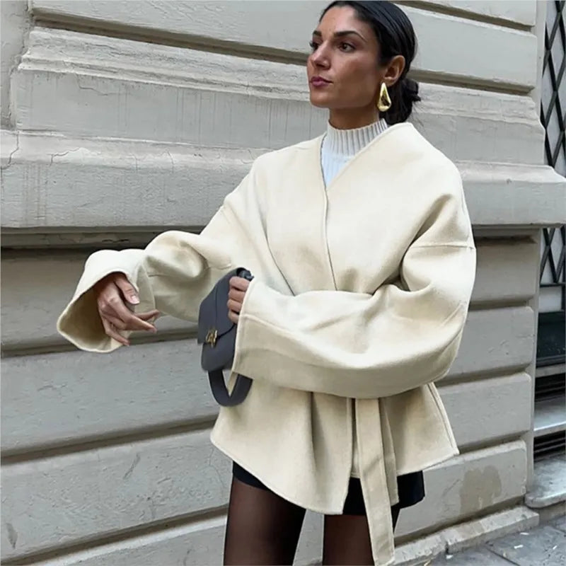 Ivory wrap coat, tie-belt at waist with flared wide sleeves