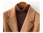 Camel wool coat with ribbed turtleneck and wide lapels