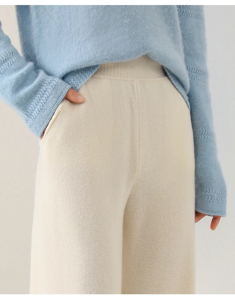 Women’s wide-leg knit pants in cream, waistband and side seam detail close-up