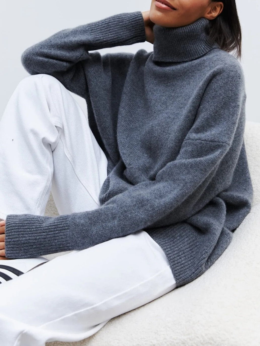Dark blue oversized turtleneck sweater, knit texture with ribbed collar and cuffs